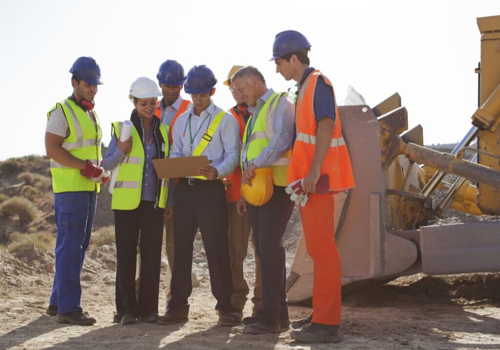 Workers and business people talking on site Workers and business people talking on site